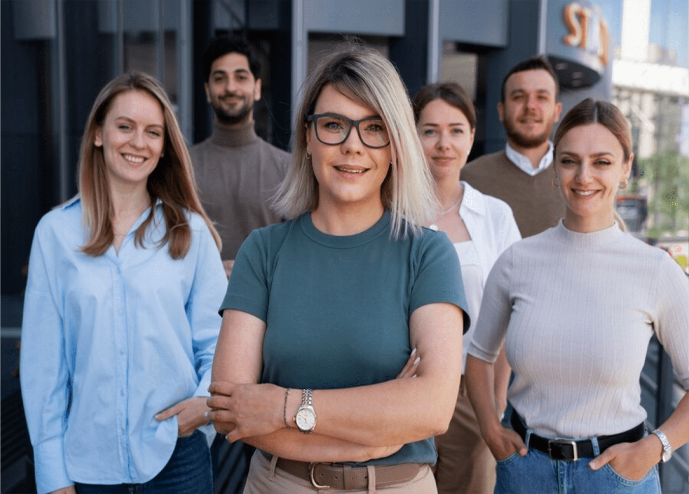 A group of people standing in front of each other.